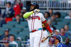 Marcell Ozuna #20 of the Atlanta Braves hits a three run home run during the first inning against the Texas Rangers at Truist Park on April 21, 2024 in Atlanta, Georgia.