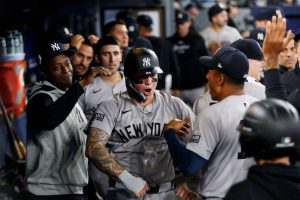 Alex Verdugo #24 of the New York Yankees celebrates in the dugout after scoring off a Aaron Judge #99 single in the ninth inning of their MLB game against the Toronto Blue Jays at Rogers Centre on April 17, 2024 in Toronto, Canada.
