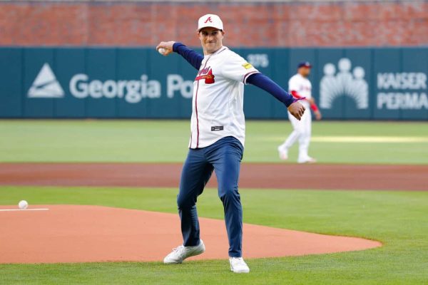 Kirk Cousins of the Atlanta Falcons throws out the first pitch prior to the game between the Texas Rangers and Atlanta Braves at Truist Park on April 21, 2024 in Atlanta, Georgia.