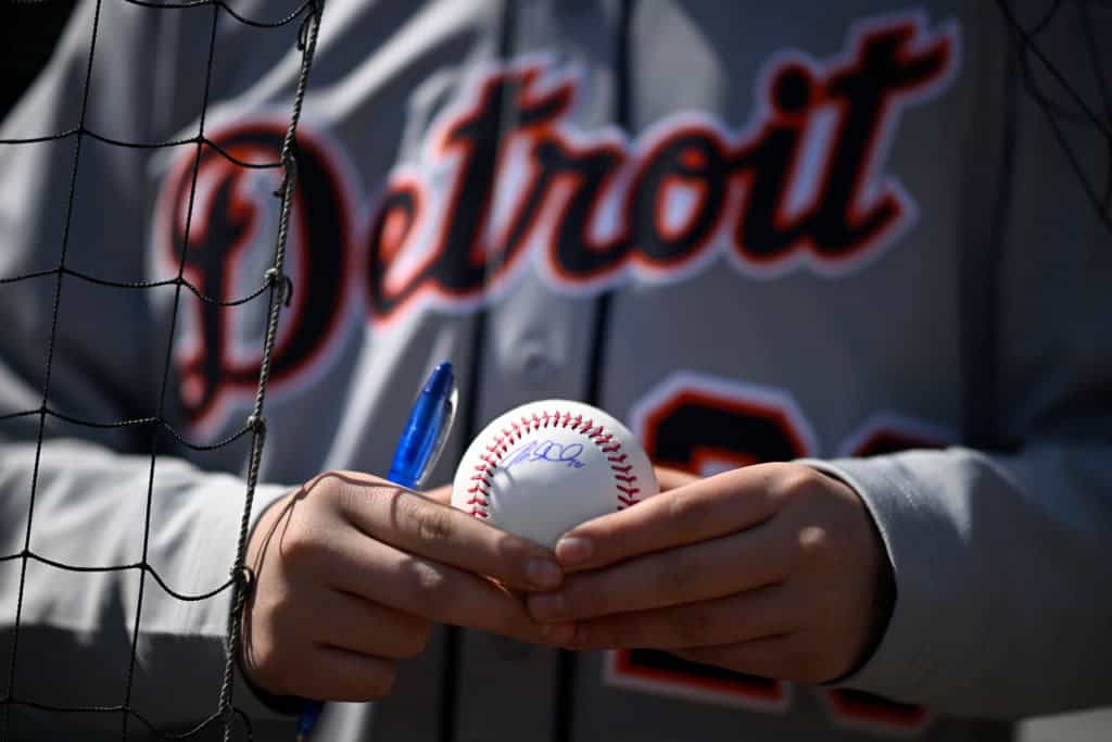 A fan gets the autograph of Mark Canha #21 before the Opening Day game between the Chicago White Sox and the Detroit Tigers at Guaranteed Rate Field on March 28, 2024 in Chicago, Illinois.