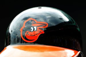 The Baltimore Orioles logo is seen on a batting helmet during the game between the Boston Red Sox and the Baltimore Orioles at Fenway Park on June 25, 2015 in Boston, Massachusetts.