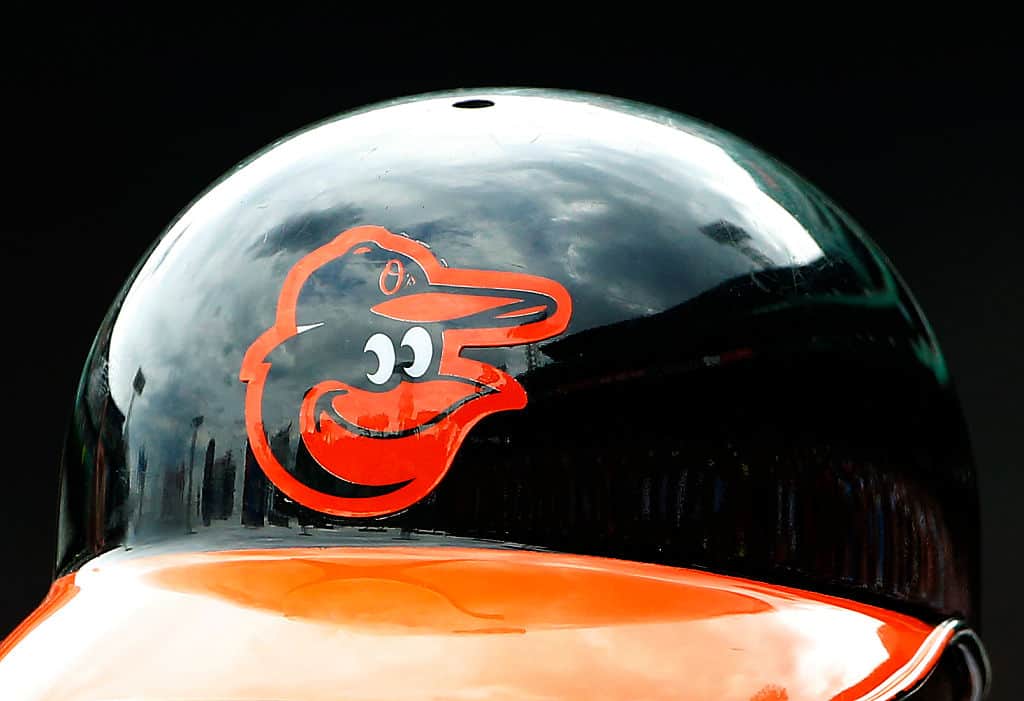 The Baltimore Orioles logo is seen on a batting helmet during the game between the Boston Red Sox and the Baltimore Orioles at Fenway Park on June 25, 2015 in Boston, Massachusetts.