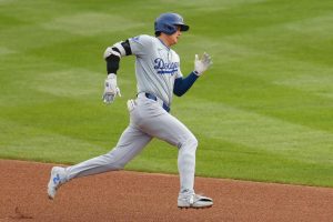 Shohei Ohtani #17 of the Los Angeles Dodgers runs to third base after hitting a triple against the Chicago Cubs during the sixth inning at Wrigley Field on April 07, 2024 in Chicago, Illinois.
