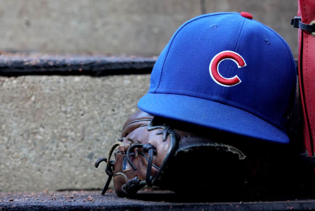A hat and glove of a Chicago Cubs player in the dugout during the game against the Cincinnati Reds at Great American Ball Park on September 02, 2023 in Cincinnati, Ohio.