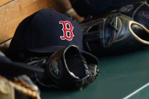 A detail of a Boston Red Sox hat in the dugout during the first inning of the game against the San Francisco Giants at Fenway Park on July 19, 2016 in Boston, Massachusetts.