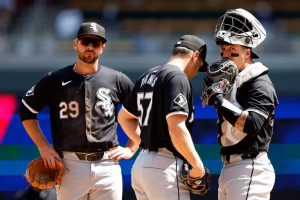 Tanner Banks #57 talks to Korey Lee #26 of the Chicago White Sox in the sixth inning against the Minnesota Twins at Target Field on April 25, 2024 in Minneapolis, Minnesota. The Twins defeated the White Sox 6-3.