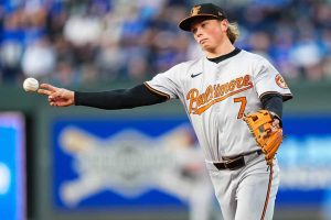 Jackson Holliday #7 of the Baltimore Orioles throws a Kansas City Royals runner out at first during the second inning at Kauffman Stadium on April 19, 2024 in Kansas City, Missouri.