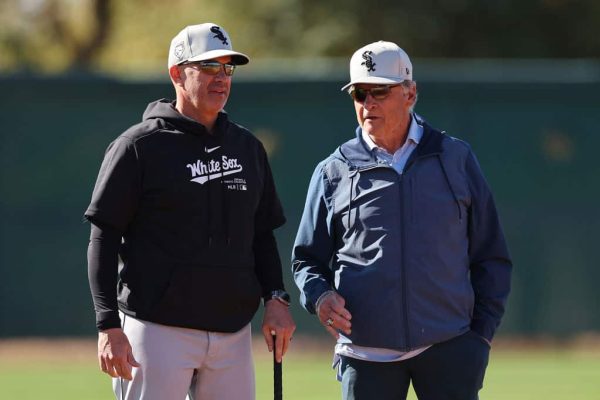 Manager Pedro Grifol #5 of the Chicago White Sox talks with senior advisor Tony La Russa during a spring training workout at Camelback Ranch on February 21, 2024 in Glendale, Arizona.
