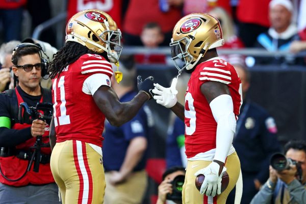 San Francisco 49ers wide receiver Deebo Samuel (19) celebrates with wide receiver Brandon Aiyuk (11) after scoring a touchdown during the first quarter against the Arizona Cardinals at State Farm Stadium. Mandatory Credit: Mark J. Rebilas-USA TODAY Sports