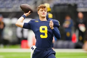 Michigan Wolverines QB J.J. McCarthy (9) throws during warmups.