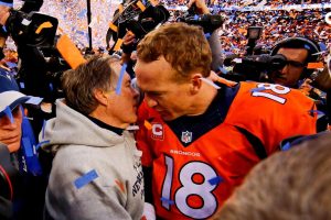 New England Patriots head coach Bill Belichick (left) and Denver Broncos quarterback Peyton Manning (18) shake hands and speak after the game in the AFC Championship football game at Sports Authority Field at Mile High.