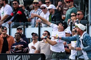 Lucas Herbert’s caddie gets hit by bottle