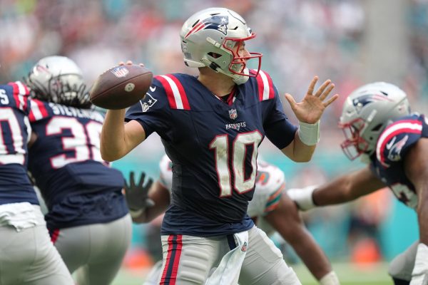 New England Patriots quarterback Mac Jones (10) drops back to pass against the Miami Dolphins during the second half of an NFL game at Hard Rock Stadium in Miami Gardens, Oct. 29, 2023.