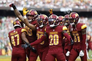 Washington Commanders cornerback Kendall Fuller (29) celebrates with teammates after recovering a fumble on the one yard line against the Philadelphia Eagles during the third quarter at FedExField.