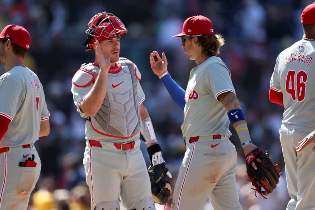 J.T. Realmuto #10 celebrates with Bryson Stott #5 of the Philadelphia Phillies after defeating the San Diego Padres 8-6 in a game at Petco Park on April 28, 2024 in San Diego, California.