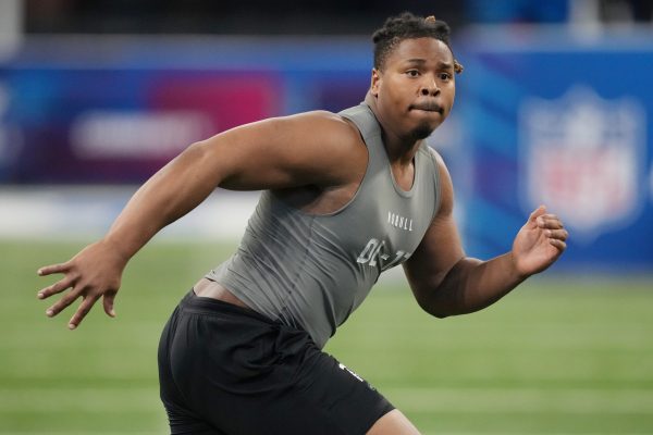 Meet Kris Jenkins: An In-Depth Look at His Physical Attributes, Age, and Background Michigan Wolverines DL Kris Jenkins performs drills at the NFL Scouting Combine.