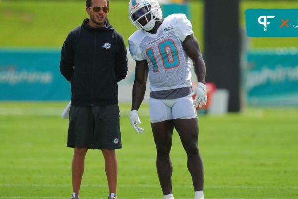 Miami Dolphins head coach Mike McDaniel talks with Miami Dolphins wide receiver Tyreek Hill (10) during practice at Baptist Health Training Complex.
