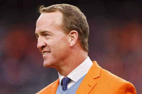 Peyton Manning looks on during a Ring of Honor induction ceremony at halftime of the game between the Washington Football Team and Denver Broncos at Empower Field At Mile High on October 31, 2021 in Denver, Colorado.