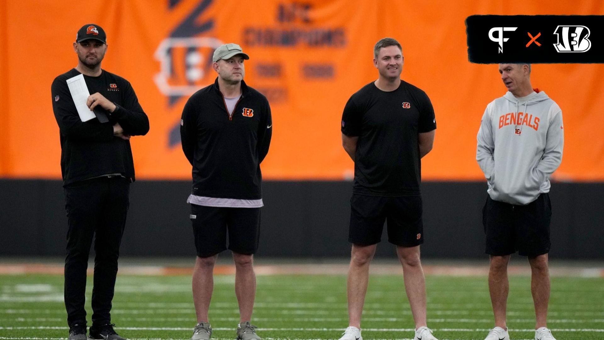 Director of college scouting Mike Potts (far left) and director of player personnel Duke Tobin (left) and head coach Zac Taylor (right) and defensive coordinator Lou Anarumo (far right) talk as rookie...