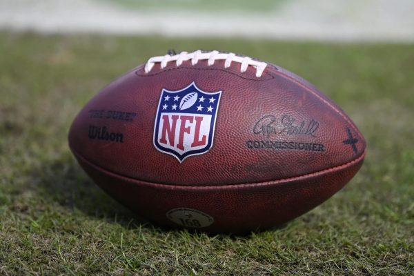 A detailed view of the NFL logo on a football prior to the game between the Minnesota Vikings and the Chicago Bears at Soldier Field on October 15, 2023 in Chicago, Illinois.