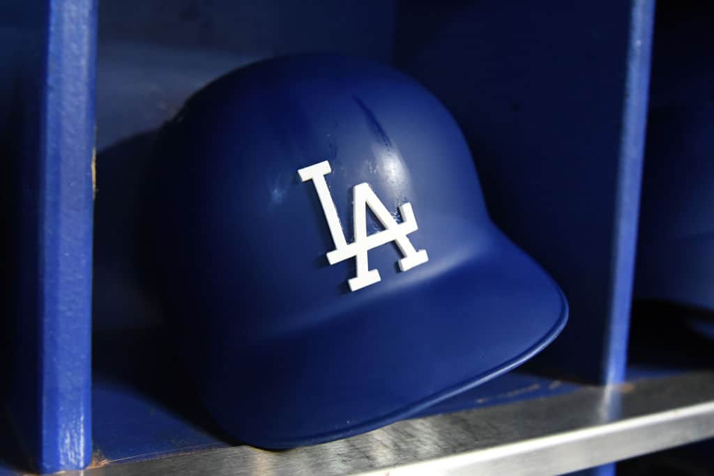 A detailed view of a Los Angeles Dodgers batting helmet in the dugout before the start of the game against the Miami Marlins at Marlins Park on May 16, 2018 in Miami, Florida.