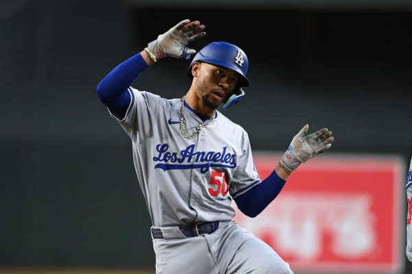 Mookie Betts #50 of the Los Angeles Dodgers reacts after hitting a two RBI single during the second inning against the Arizona Diamondbacks at Chase Field on May 01, 2024 in Phoenix, Arizona.