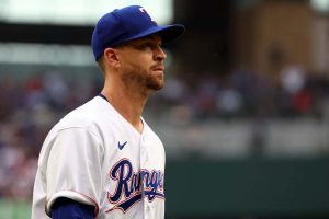 Jacob deGrom #48 of the Texas Rangers walks back to the dugout during a game against the Philadelphia Phillies on Opening Day at Globe Life Field on March 30, 2023 in Arlington, Texas.