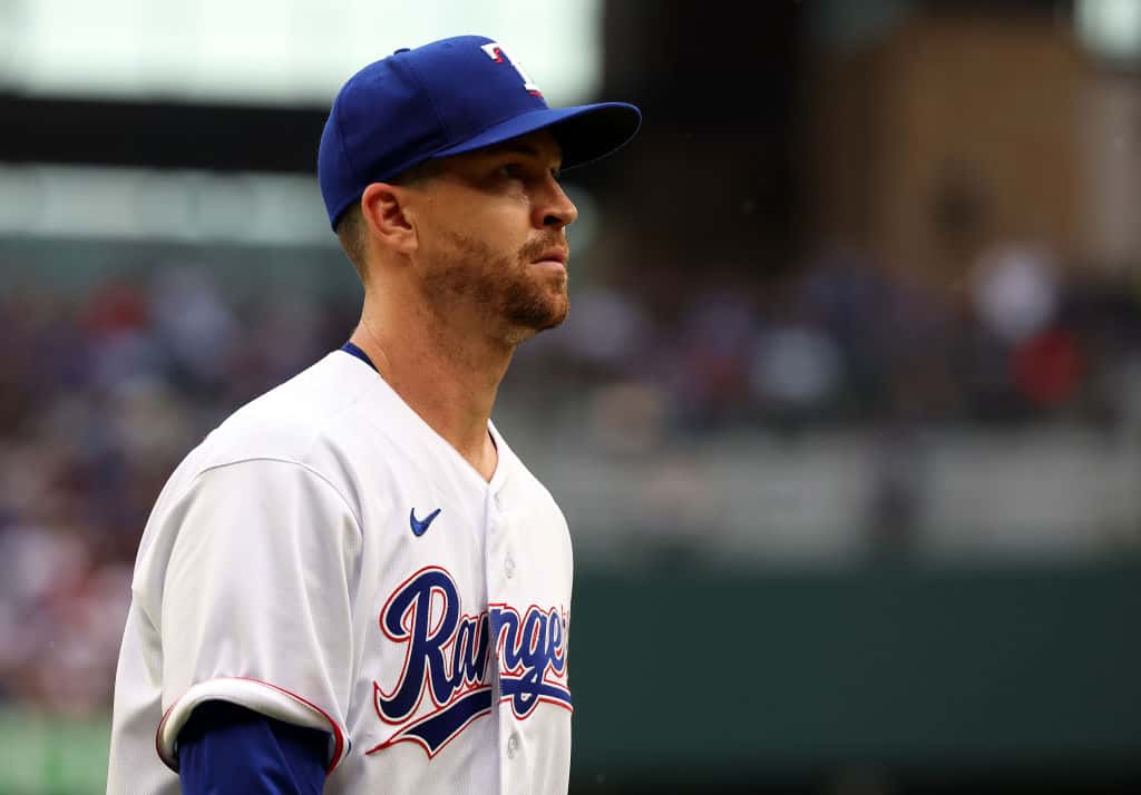 Jacob deGrom #48 of the Texas Rangers walks back to the dugout during a game against the Philadelphia Phillies on Opening Day at Globe Life Field on March 30, 2023 in Arlington, Texas.