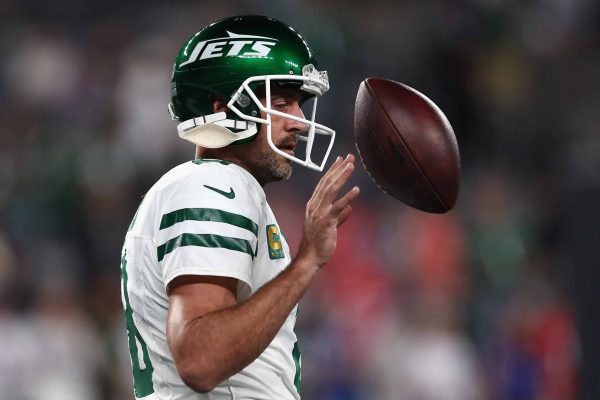Quarterback Aaron Rodgers #8 of the New York Jets warms up before the NFL game against the Buffalo Bills at MetLife Stadium on September 11, 2023 in East Rutherford, New Jersey.