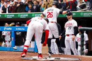 Max Kepler #26 of the Minnesota Twins celebrates his solo home run against the Boston Red Sox with teammates in the fourth inning at Target Field on May 04, 2024 in Minneapolis, Minnesota. The Twins defeated the Red Sox 3-1.