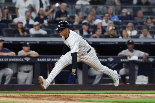 Juan Soto #22 of the New York Yankees scores a run against the Houston Astros in the fourth inning during their game at Yankee Stadium on May 07, 2024 in New York City.