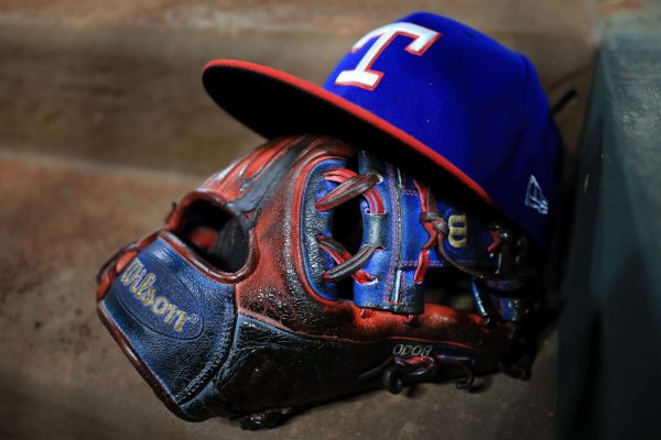 A view of the glove and hat of Rougned Odor #12 of the Texas Rangers as the Texas Rangers take on the Los Angeles Angels at Globe Life Park in Arlington on July 8, 2017 in Arlington, Texas.