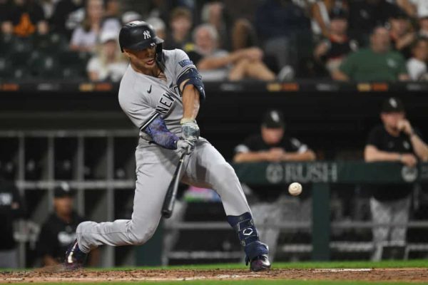 Giancarlo Stanton #27 of the New York Yankees bats in a run after grounding out in the third inning against the Chicago White Sox at Guaranteed Rate Field on August 09, 2023 in Chicago, Illinois.