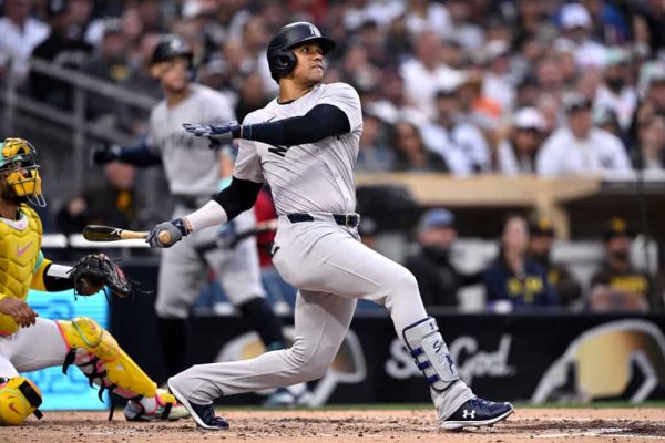 Juan Soto #22 of the New York Yankees hits a two-run home run against the San Diego Padres during the third inning at Petco Park on May 24, 2024 in San Diego, California.