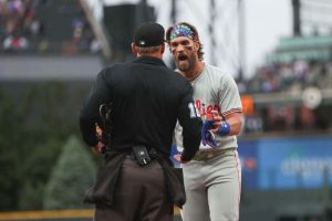 Bryce Harper #3 of the Philadelphia Phillies argues with umpire Bruce Dreckman #1 after being ejected during the first inning of the game against the Colorado Rockies at Coors Field on May 24, 2024 in Denver, Colorado.