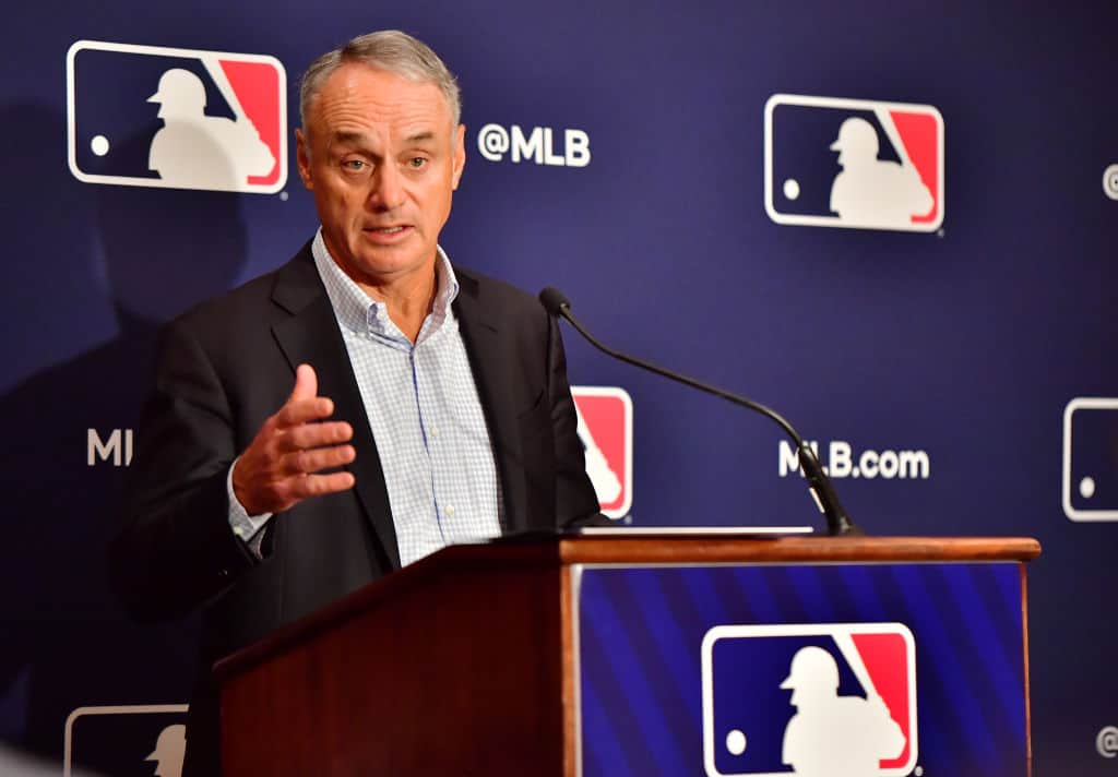 Major League Baseball Commissioner Rob Manfred answers questions during an MLB owner