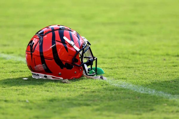 Two Cincinnati Bengals Standouts Opt Out of Voluntary OTAs Due to Contract Disagreements A Cincinnati Bengals helmet sits on the grass before the start of a preseason game between the Bengals and Washington Commanderat FedExField on August 26, 2023 in Landover, Maryland.