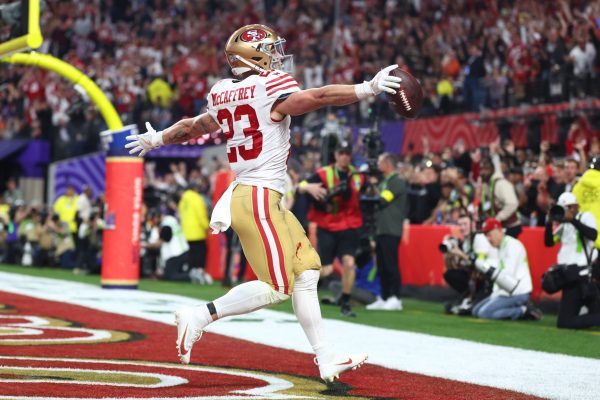 San Francisco 49ers running back Christian McCaffrey (23) scores a touchdown in the first half of Super Bowl LVIII at Allegiant Stadium.