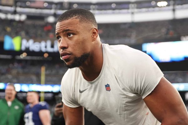 EAST RUTHERFORD, NEW JERSEY - OCTOBER 29: Saquon Barkley #26 of the New York Giants looks on after his team