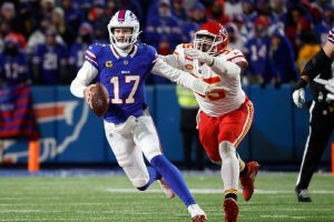 Buffalo Bills quarterback Josh Allen (17) is caught from behind by Kansas City Chiefs defensive tackle Chris Jones (95).