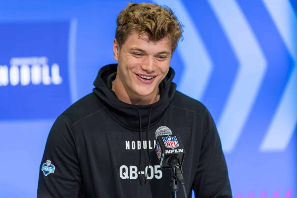 INDIANAPOLIS, INDIANA - MARCH 01: JJ McCarthy #QB05 of the Michigan Wolverines speaks to the media during the 2024 NFL Draft Combine at Lucas Oil Stadium on March 01, 2024 in Indianapolis, Indiana.