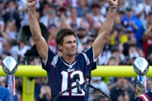 Tom Brady acknowledges his fans during a halftime celebration and the announcement of his induction in the the Patriots Hall of Fame.