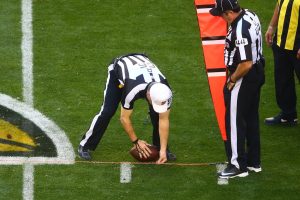NFL referee Walt Anderson spots the ball after measuring with the chains during the game between the San Francisco 49ers and Arizona Cardinals players at University of Phoenix Stadium. NFL optical tracking will be a key thing to watch during this year's preseason.