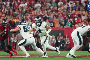 Philadelphia Eagles quarterback Jalen Hurts (1) runs with the ball against the Tampa Bay Buccaneers during the second half of a 2024 NFC wild card game at Raymond James Stadium.