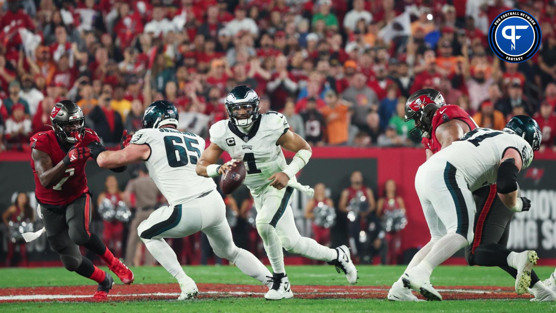 Philadelphia Eagles quarterback Jalen Hurts (1) runs with the ball against the Tampa Bay Buccaneers during the second half of a 2024 NFC wild card game at Raymond James Stadium.