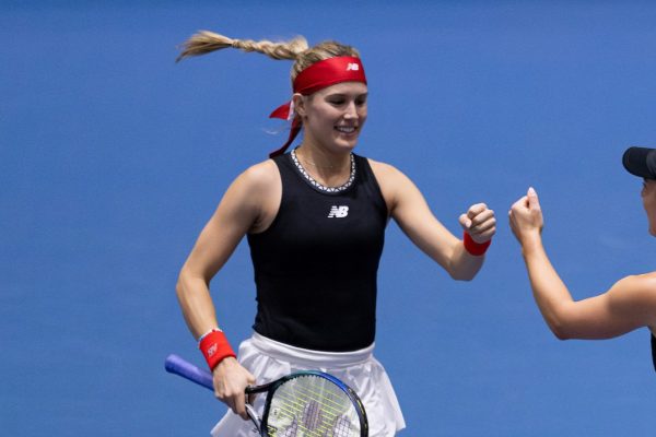 Eugenie Bouchard fist-bumps Gabriela Dabrowski. Bouchard competed at an ITF event this week.