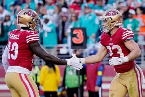 Deebo Samuel #19 of the San Francisco 49ers celebrates with Christian McCaffrey #23 of the San Francisco 49ers after McCaffrey