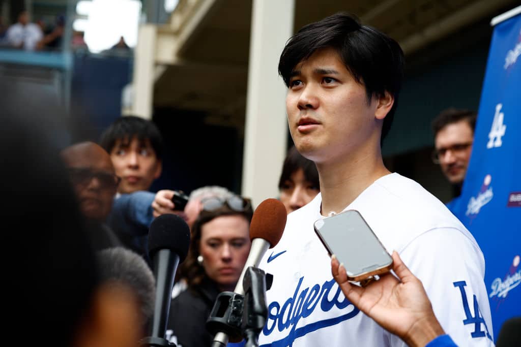 Shohei Ohtani #17 of the Los Angeles Dodgers speaks with the media during DodgerFest at Dodger Stadium on February 03, 2024 in Los Angeles, California.