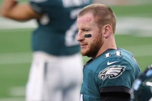 Carson Wentz #11 of the Philadelphia Eagles looks on before the game against the Dallas Cowboys at AT&T Stadium on December 27, 2020 in Arlington, Texas.