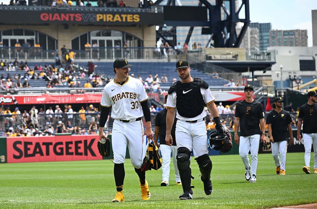 Paul Skenes #30 of the Pittsburgh Pirates talks with Joey Bart #14 as they walk in from the bullpen before the start off the game against the San Francisco Giants at PNC Park on May 23, 2024 in Pittsburgh, Pennsylvania.